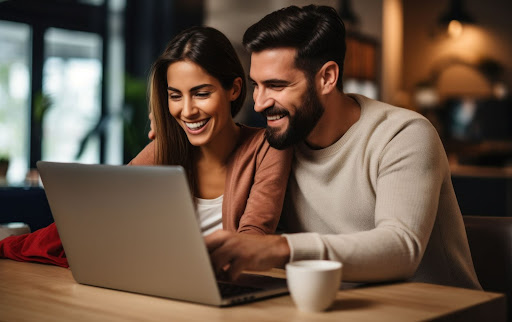 ai generated image of couple smiling at laptop