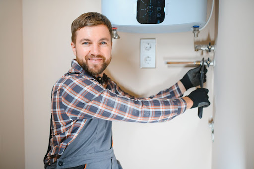 heating engineer working on  boiler pipes